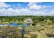 Aerial view of house on waterfront property with lush landscape at 13910 Max Hooks Rd, Clermont, FL 34711