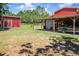 Property features two barns, one with covered parking and boat storage at 13910 Max Hooks Rd, Clermont, FL 34711