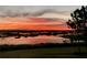 Reflecting sunset over calm waters at 13910 Max Hooks Rd, Clermont, FL 34711