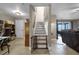 Indoor staircase with wood treads and a baby gate at 13910 Max Hooks Rd, Clermont, FL 34711