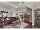 Spacious living room with high ceilings, hardwood floors, and ample natural light at 13910 Max Hooks Rd, Clermont, FL 34711