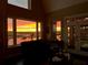 Living room with sunset view and access to backyard at 13910 Max Hooks Rd, Clermont, FL 34711