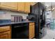 Modern kitchen with black appliances and granite countertops at 13910 Max Hooks Rd, Clermont, FL 34711