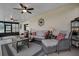 Covered patio with wicker furniture and a view of the water at 13910 Max Hooks Rd, Clermont, FL 34711