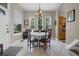 Charming dining room with a round table and four chairs, adjacent to kitchen at 13910 Max Hooks Rd, Clermont, FL 34711