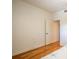 Spare bedroom with hardwood floors and door at 601 N Mcdonald St # 608, Mount Dora, FL 32757