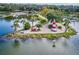 Picturesque lighthouse on a small island with palm trees and benches, showing nearby marina at 601 N Mcdonald St # 608, Mount Dora, FL 32757