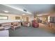 Community room with sofas, chairs, and a bar at 601 N Mcdonald St # 608, Mount Dora, FL 32757