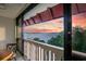 Stunning sunset view over the water from a condo balcony at 601 N Mcdonald St # 608, Mount Dora, FL 32757