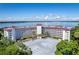 Aerial view showcasing building and waterfront at 601 N Mcdonald St # 608, Mount Dora, FL 32757