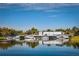 Calm waters reflect a row of boat docks, offering convenient access to the lake at 601 N Mcdonald St # 608, Mount Dora, FL 32757