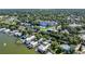Aerial view of waterfront community, highlighting the property's proximity to the lake and surrounding homes at 601 N Mcdonald St # 608, Mount Dora, FL 32757
