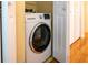 Compact laundry closet with washer and dryer at 601 N Mcdonald St # 608, Mount Dora, FL 32757