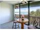 Small dining area with tiled floor and water views at 601 N Mcdonald St # 608, Mount Dora, FL 32757