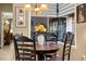Cozy breakfast nook with a round table and four chairs at 8692 Crested Eagle Pl, Sanford, FL 32771