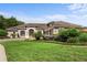 Beautiful one-story home with a lush lawn and mature landscaping at 8692 Crested Eagle Pl, Sanford, FL 32771