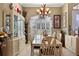 Bright dining room with a table and chairs, and a built-in hutch at 8692 Crested Eagle Pl, Sanford, FL 32771