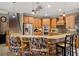 Kitchen boasts an island with seating, ample cabinetry, and stainless steel appliances at 8692 Crested Eagle Pl, Sanford, FL 32771
