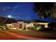 Single Gathering home beautifully lit at night at 8692 Crested Eagle Pl, Sanford, FL 32771