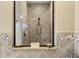 Walk-in shower with tiled walls and built-in seating at 8692 Crested Eagle Pl, Sanford, FL 32771