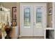 Elegant double front doors with etched glass details at 8692 Crested Eagle Pl, Sanford, FL 32771