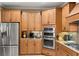 Modern kitchen featuring stainless steel appliances and ample cabinetry at 8692 Crested Eagle Pl, Sanford, FL 32771