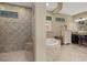 Bathroom with walk-in shower, soaking tub, and double sinks at 8692 Crested Eagle Pl, Sanford, FL 32771