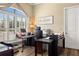 Spacious home office with built-in cabinetry and large window at 8692 Crested Eagle Pl, Sanford, FL 32771