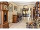 A home bar with a rich wooden finish and comfortable seating area at 8692 Crested Eagle Pl, Sanford, FL 32771