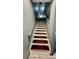 Modern staircase leading to upper level at 110 Lake Tracy Ct, Haines City, FL 33844