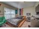 Spacious bedroom with large window and plush bed at 32313 Oak Canopy Dr, Sorrento, FL 32776