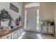 Bright and spacious entryway with built-in bench and storage at 32313 Oak Canopy Dr, Sorrento, FL 32776