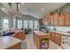 Open concept kitchen with island, ample counter space, and breakfast nook at 32313 Oak Canopy Dr, Sorrento, FL 32776