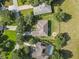 Aerial view of homes, showing a house with a pool in a residential area at 32313 Oak Canopy Dr, Sorrento, FL 32776