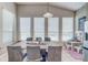 Casual dining area with large table and plenty of natural light at 32313 Oak Canopy Dr, Sorrento, FL 32776