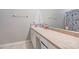 Clean bathroom with tiled countertop and shower/tub combo at 32313 Oak Canopy Dr, Sorrento, FL 32776