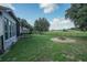 Large backyard with firepit and plenty of grass space at 32313 Oak Canopy Dr, Sorrento, FL 32776