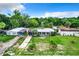 Aerial view of three homes in a waterfront community at 34035 Linda Ln, Leesburg, FL 34788