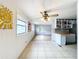 Open living space with wood-look floors and view to kitchen at 34035 Linda Ln, Leesburg, FL 34788