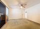 Well-lit bedroom with sliding glass doors and ceiling fan at 34035 Linda Ln, Leesburg, FL 34788