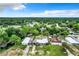 Aerial view of houses near waterfront with lush greenery at 34035 Linda Ln, Leesburg, FL 34788