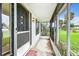 Enclosed porch with a view of the yard at 34035 Linda Ln, Leesburg, FL 34788