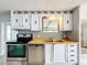 Modern kitchen with stainless steel appliances and wood countertops at 34035 Linda Ln, Leesburg, FL 34788