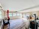 Spacious living room with wood floors and a red fireplace at 34035 Linda Ln, Leesburg, FL 34788