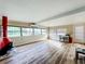 Living room featuring wood floors and lots of windows at 34035 Linda Ln, Leesburg, FL 34788