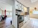 Kitchen with modern stove and white cabinets at 34035 Linda Ln, Leesburg, FL 34788