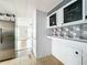 View of kitchen with stainless steel refrigerator at 34035 Linda Ln, Leesburg, FL 34788
