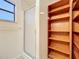 Bathroom features a shower and built-in shelving at 34035 Linda Ln, Leesburg, FL 34788
