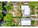 Aerial view of property with canal, buildings, and boat at 34035 Linda Ln, Leesburg, FL 34788