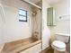 Clean bathroom with shower/tub combo, toilet, and vanity at 34035 Linda Ln, Leesburg, FL 34788